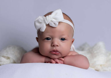 Soft off-white and beautifully bold — this larger bow tieback adds a touch of classic charm to every moment.