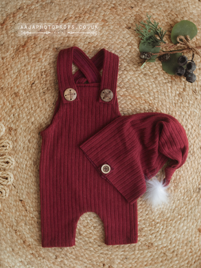 Christmas dungarees romper with a hat in red colour with faux fur pom pom. Buttons.
